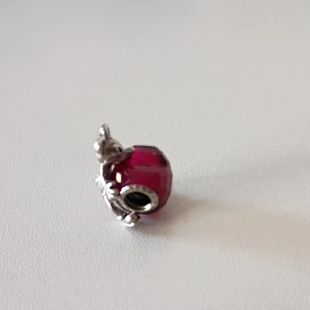 Pandora Disney Mickey Mouse Heart charm featuring a fuchsia crystal.